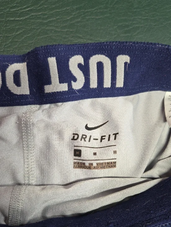 **Nike Women’s Purple Athletic Running Shorts with White Accents** - Picture 2 of 6